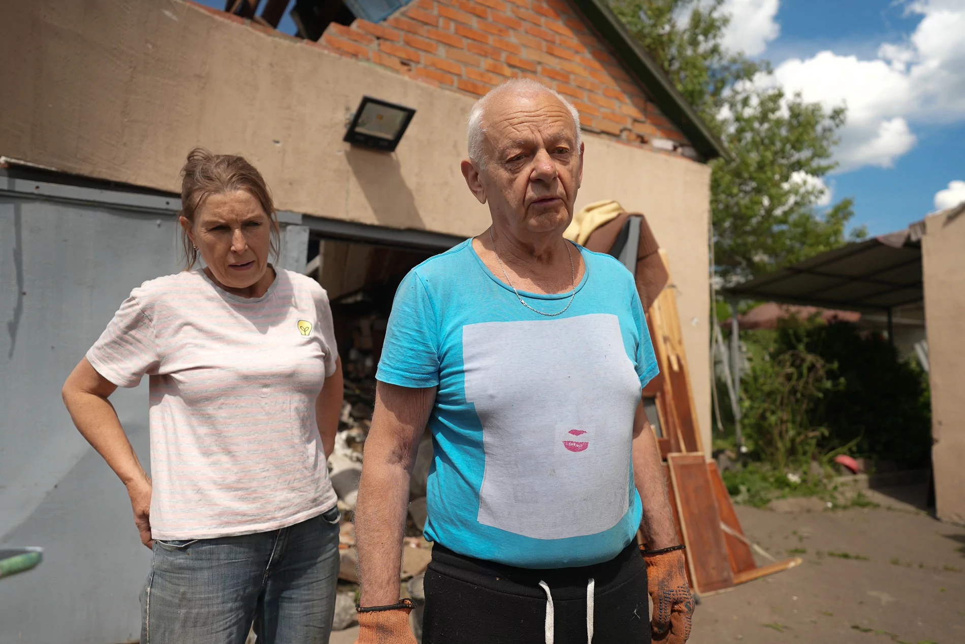 Kharkiv oblast locals whose house was damaged by Russian attack.