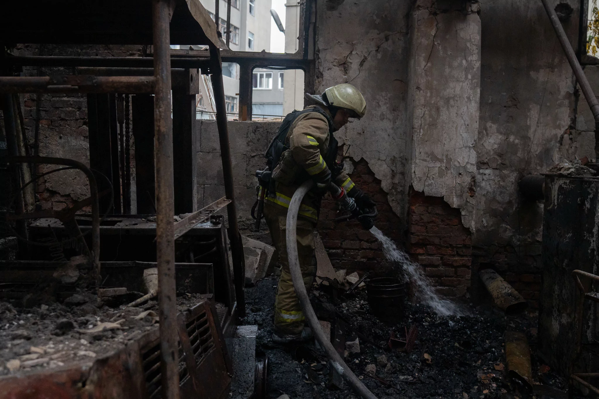 A firefighter extinguishes a fire