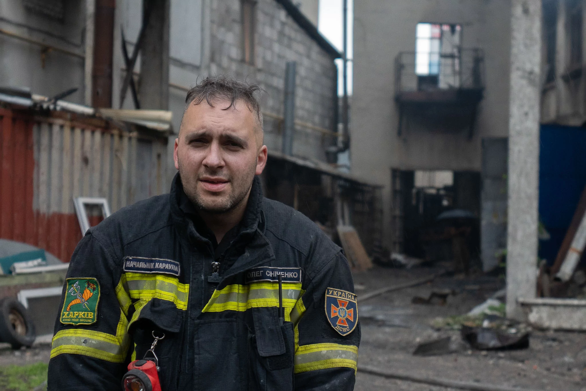 Rescuer after putting out a fire after Russian attack on Kharkiv