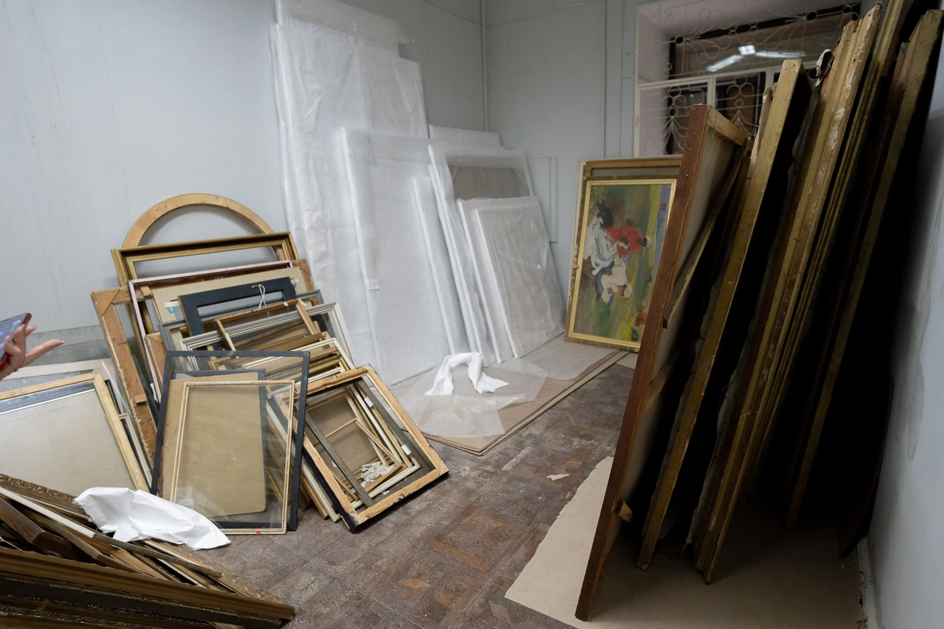 Paintings lie on the floor in one of the rooms at the Kharkiv Art Museum