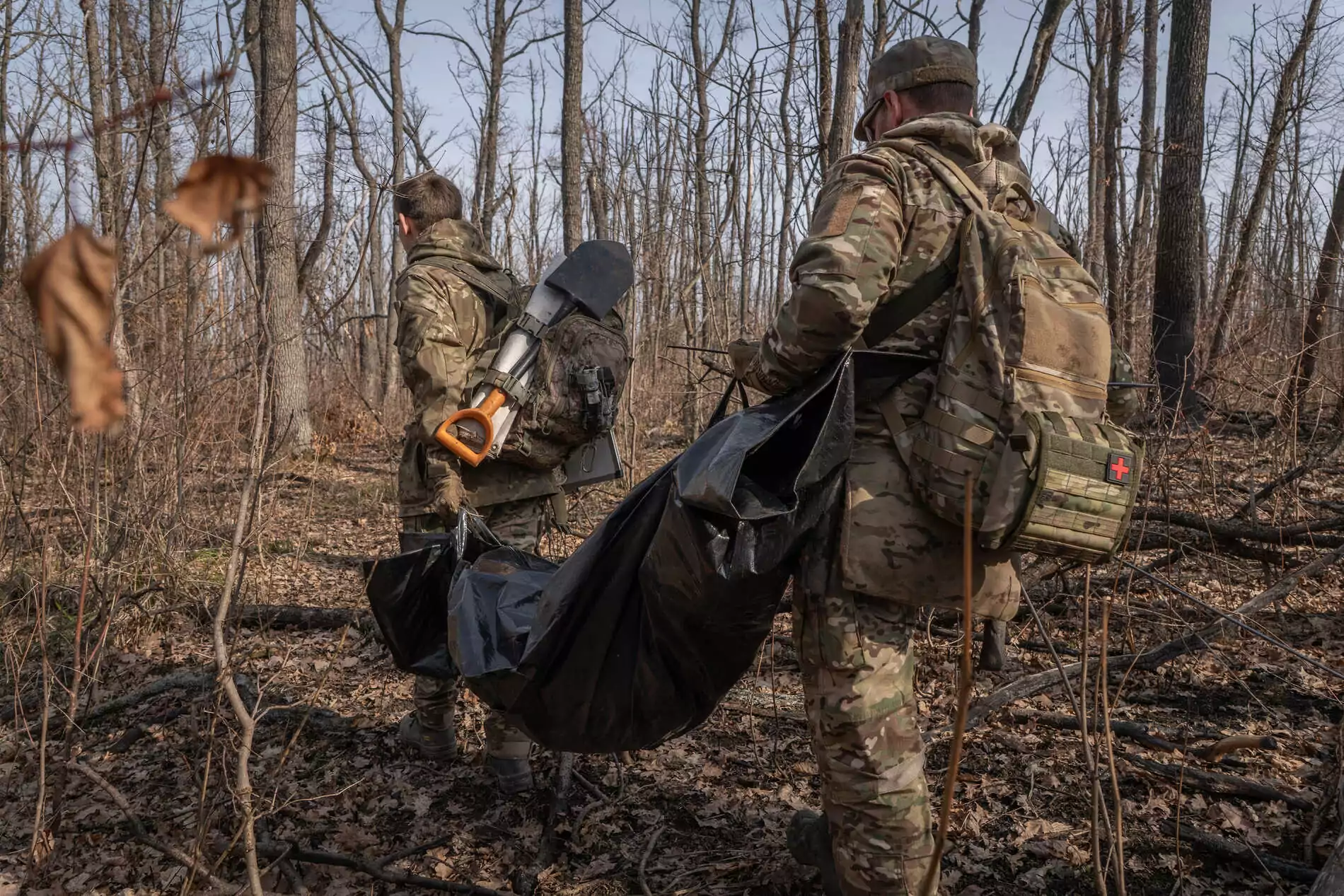 The exhumation team is carrying a bag containing the remains
