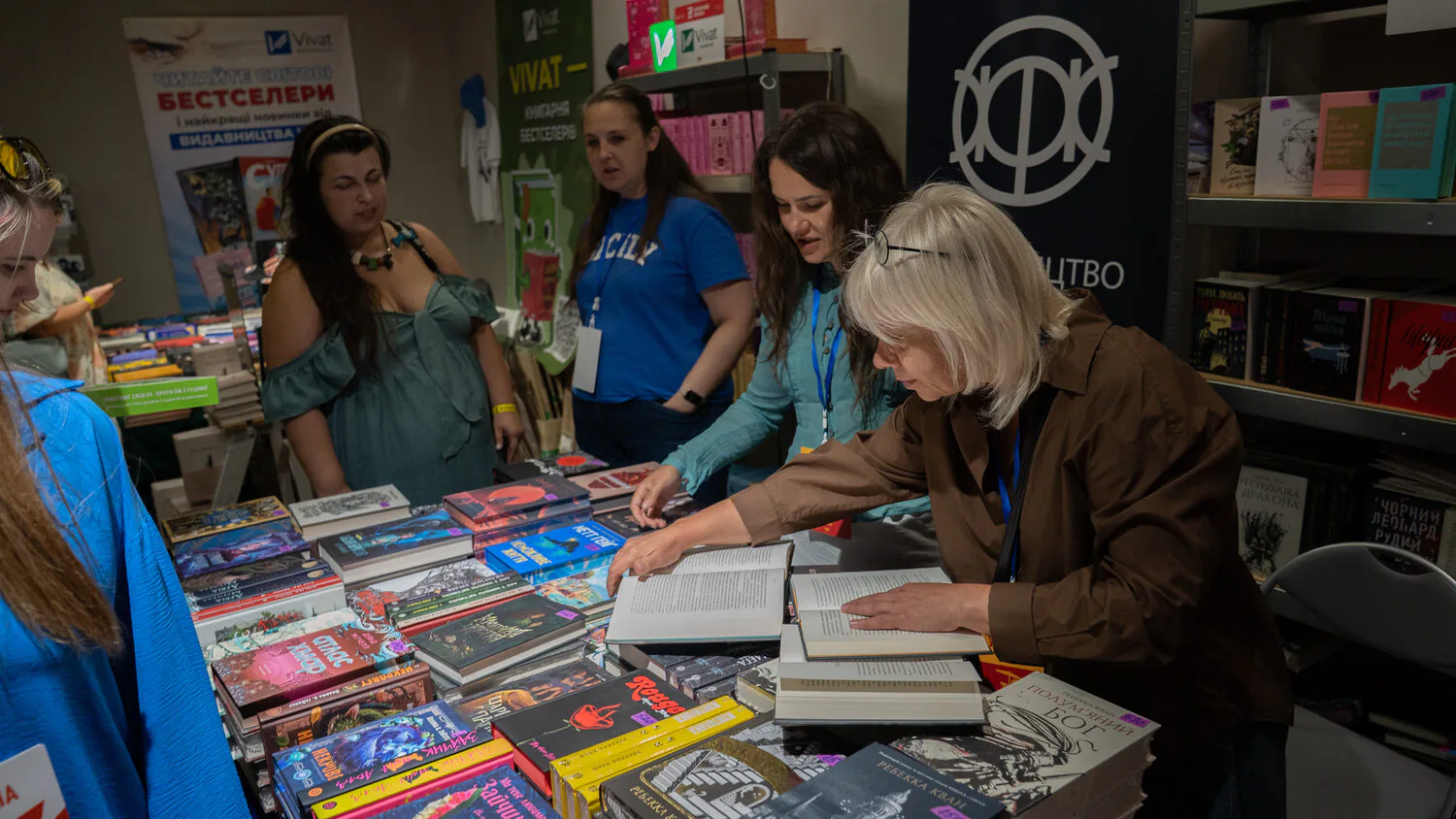 Natalia Protas looks through books at the Zhоrzh publishing house’s table / Photo: Gwara Media, Katia Deviatko