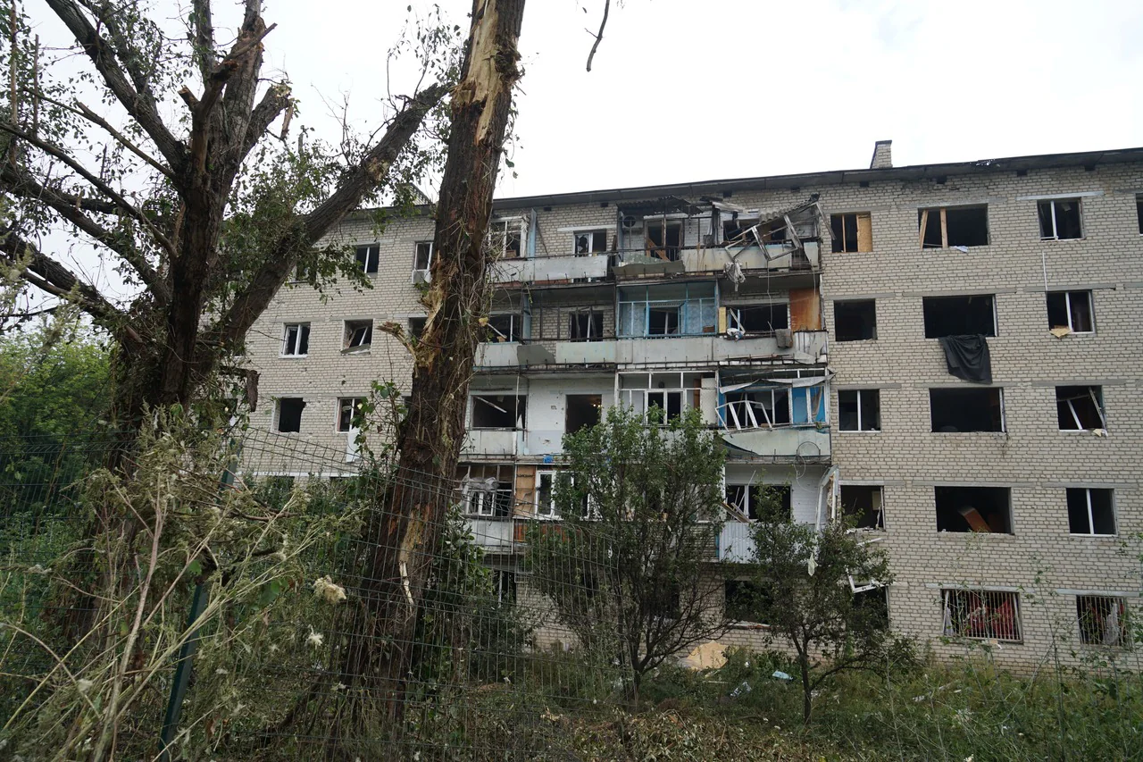 Damaged apartment building in Izium