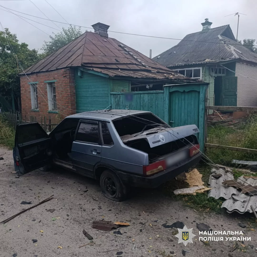 Damaged house and car in Kharkiv oblast
