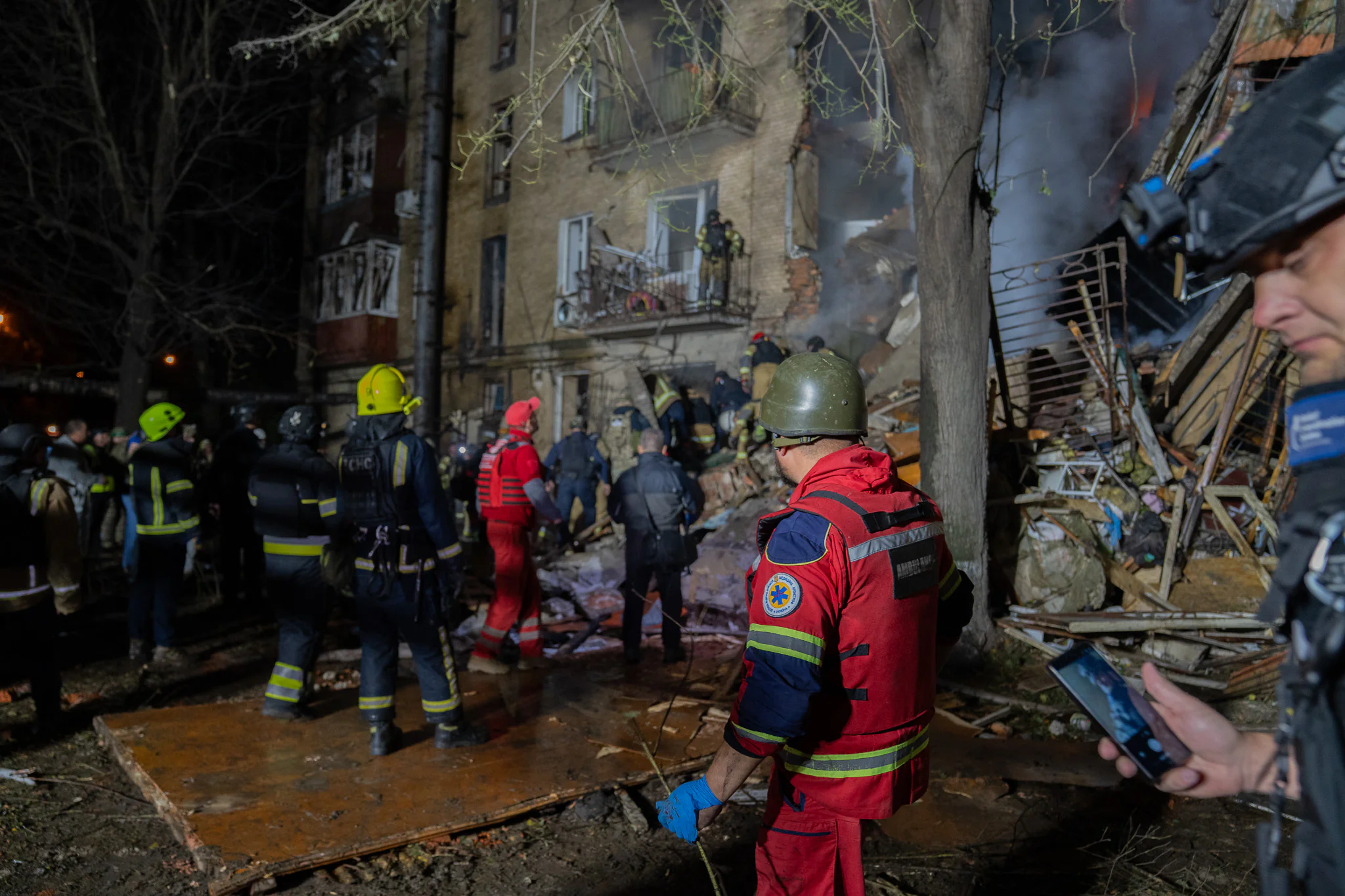 Medics provide help to the injured rescuer in Kharkiv