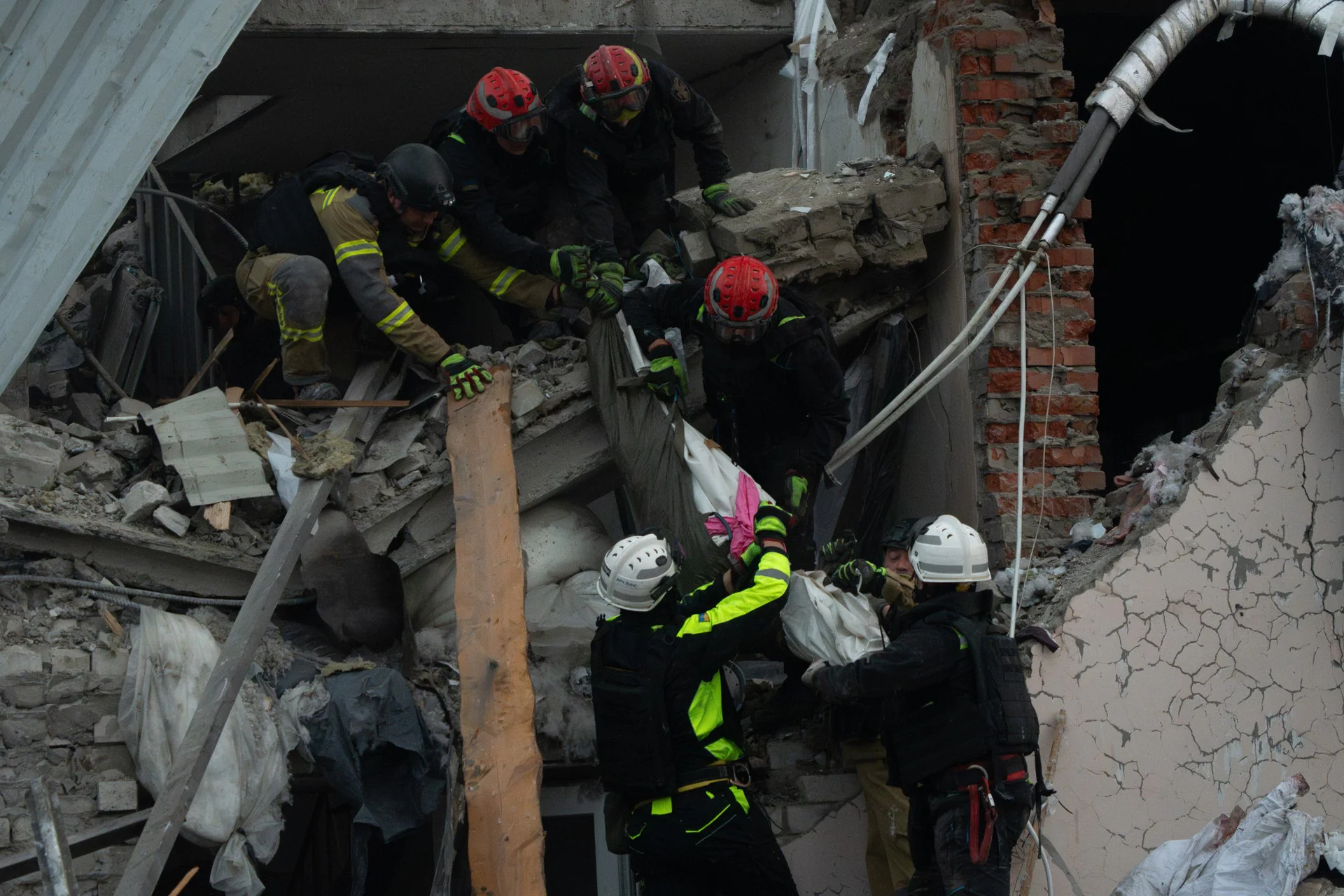 First responders are pulling the body down from the rubble